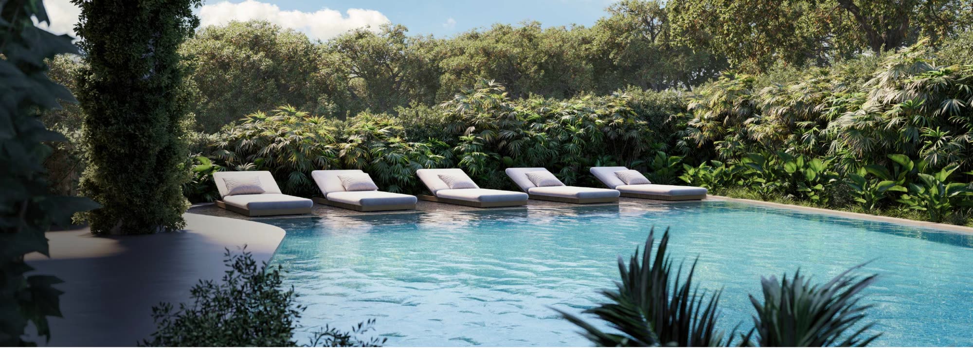 Panoramic ocean-view pool surrounded by jungle, Luma Biohacking Resort